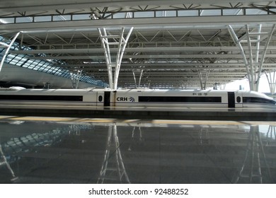 SHANGHAI, CHINA - NOVEMBER 27: A Bullet Train Sits At The Shanghai Hong Qiao Station  Awaiting For Passengers On November 27, 2011 In Shanghai, China. High Speed Trains Cut Traveling Time By A Third.