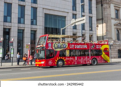SHANGHAI, CHINA - OCT 24, 2014: Shanghai Sightseeing Open-top tour bus with audio guide, various languages available, is the great way see the Shanghai's major sights in short time. 
