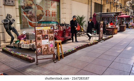 Shanghai, China - October 11, 2018: Two Chinese Guys Preparing A Classical Traditional Street Performance In Nanjing Road.