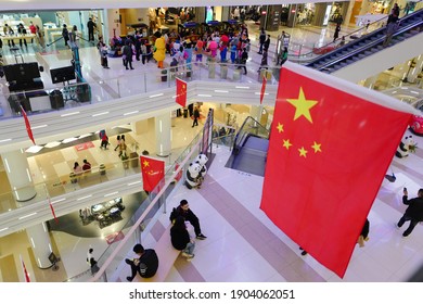 Shanghai, China - October 18, 2020: A Large Shopping Mall In The Central City Is Festooned With Chinese Flags In Celebration Of The National Day After The Victory Against The Covid-19 Epidemic.