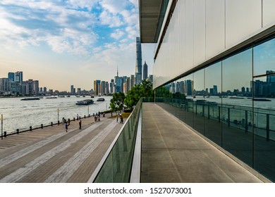 SHANGHAI, CHINA - OCTOBER 2019: Huangpu River Picturesque Leading Lines View Of Promenade At Shanghai MOCA Museum Of Contemporary Art During Sunset