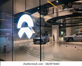 Shanghai, China - Sep 3, 2020: NIO Logo And The NIO Store In Downtown. Retail Display Of Store At Shanghai Center Mall In Night. NIO Is A Chinese Electric Car Brand. NIO Cars Inside The Store