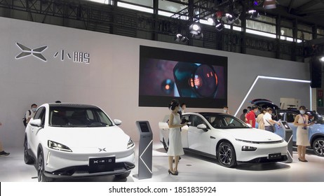 Shanghai, China - Sep 30, 2020: Xpeng booth showroom in Shanghai Pudong International Auto Show. Car exhibition and vehicle promotion. Auto business and economy staff with mask coronavirus period