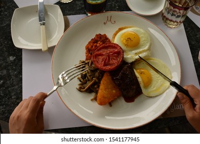 Shanghai, China - September 14, 2019: Just About To Have A Breakfast In Restaurant. Full English Breakfast With Bacon, Sausage, Fried Egg, Baked Beans And Mushrooms.