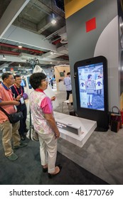 SHANGHAI, CHINA - SEPTEMBER 2, 2016: Attendees Of Huawei Connect 2016 Information Technology Conference Test Virtual Fitting Room Simulator At Exhibition Hall In Shanghai, China On September 2, 2016.
