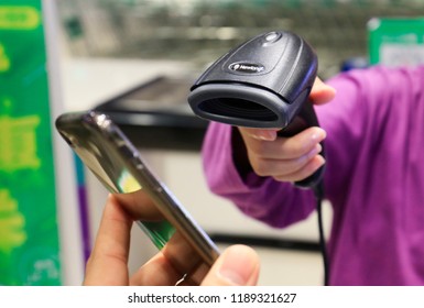 SHANGHAI CHINA-September 26, 2018: customers shop in a shopping mall using Alipay mobile wallet, WeChat payment and supermarket sweep code gun. becomes very common and popular in China,fast and safe.