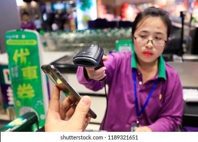 SHANGHAI CHINA-September 26, 2018: Customers Shop In A Shopping Mall Using Alipay Mobile Wallet, WeChat Payment And Supermarket Sweep Code Gun. Becomes Very Common And Popular In China,fast And Safe.