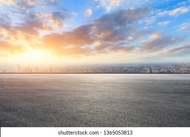 Shanghai city skyline and asphalt race track ground at sunrise,high angle view