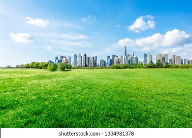 Shanghai City Skyline And Green Grass Under The Blue Sky,China