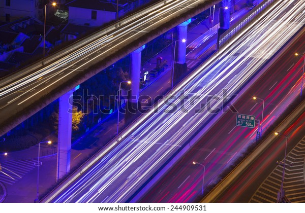shanghai city\
traffic in night with car lamp\
track