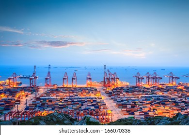 Shanghai Container Terminal In Twilight Ablaze With Lights 