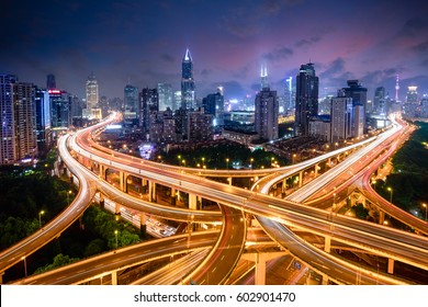 Shanghai elevated road junction and interchange overpass at night, Shanghai China - Powered by Shutterstock