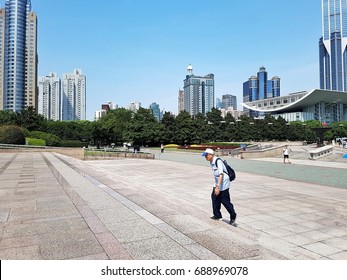 SHANGHAI, JULY 2017: An Old Man Walking Up The Steps Of The Shanghai Museum 