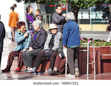 SHANGHAI - NOV 4, 2012: Old Chinese People In East Nanjing Road, Shanghai, China. China Is Facing The Aging Population Problem Due To Its 36 Years One Child Policy.