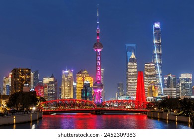 Shanghai skyline at Bund with Oriental Pearl Tower downtown at twilight night in China - Powered by Shutterstock