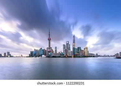 Shanghai Skyline And Cityscape With Typhoon Sky At Sunrise