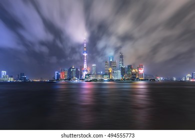 Shanghai Skyline And Cityscape With Typhoon Sky At Night