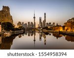 shanghai skyline panorama in sunset, pudong financial center with huangpu river, China