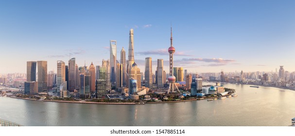 shanghai skyline panorama in sunset, pudong financial center with huangpu river, China.
