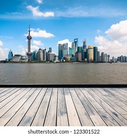 Shanghai Skyline With Wooden Floor At Daytime