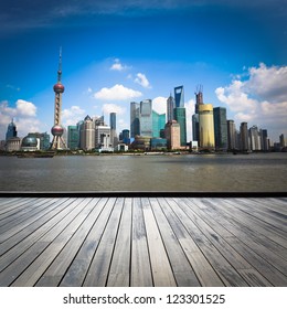 Shanghai Skyline With Wooden Floor At Daytime,China