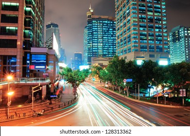 Shanghai Street View With Urban Scene And Busy Traffic At Dusk.