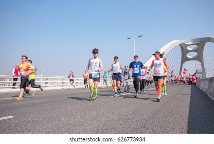 SHANGHAI,CHINA - April 23, 2017: Visually Impaired Marathon Runner And His Guide Running On City Road  At 2017 Shanghai International Half Marathon.