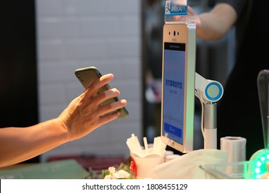 Shanghai/China-August 2020: people using Alipay to pay by scan the QR code on phone