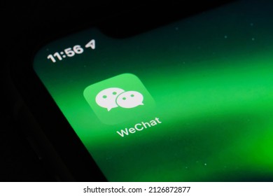 Shanghai,China-Feb. 19th 2022: close up Wechat mobile app icon on phone screen.  A Chinese instant messaging, social media and mobile payment app developed by Tencent