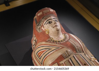 Shanghai,China-Feb.27th 2022: Close Up Mummy Cover For A Young Girl. Ancient Egyptian Authentic Mummy. Gilded, Painted Plaster And Linen.