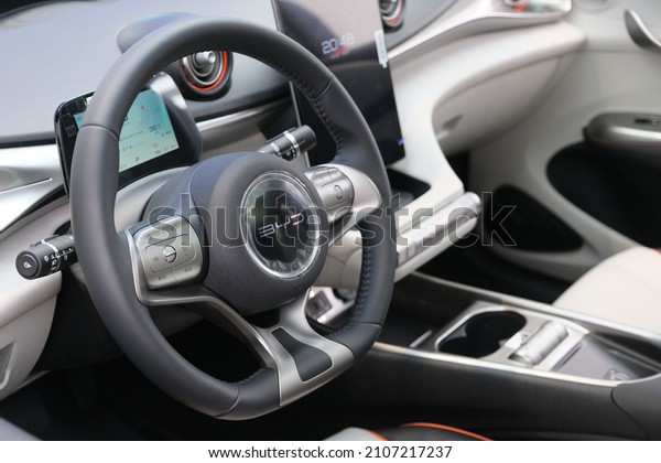 Shanghai.China-Jan.14th 2022: BYD Auto EV interior\
design and logo on steering wheel. BYD (Build Your Dreams) is a\
Chinese electric car\
brand