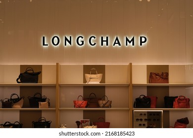 Shanghai,China-June 12th 2022: Longchamp Store Sign And Handbag Products. A French Luxury Leather Goods Company