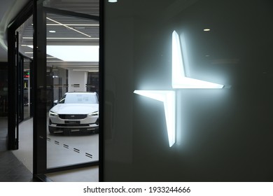 Shanghai.China-March 2021: close up Polestar logo with electric car in store. Polestar is a Swedish automotive brand owned by Volvo Cars and Geely