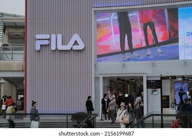 Shanghai,China-March 6th 2022: Chinese Customers In Face Mask, Outside Large FILA Flagship Store. 