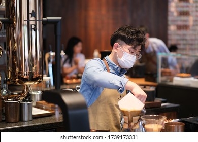 Shanghai/China-May 2020: Close Up Clerk Wearing Face Mask To Avoid Covid-19 Coronavirus, Working In Coffee Shop 