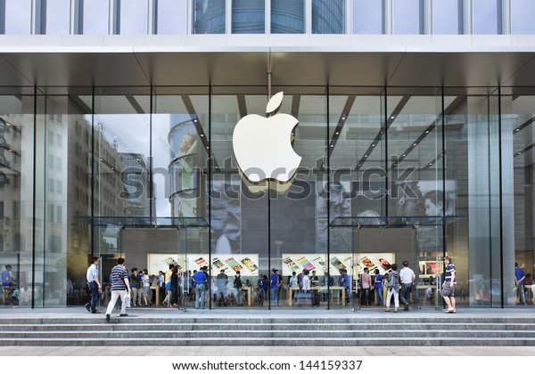 SHANGHAI-JUNE 6. Apple store in Nanjing East Road.\
Apple\'s flagship stores in China are packed with people who often\
line up to grab on one of the company\'s latest gadgets. Shanghai,\
June 6, 2013.