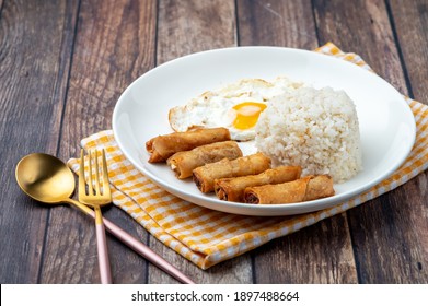 Shanghaisilog  (side Shot With Cutlery)- Is A Famous Filipino Meal That Consists Of Fried Rice, Egg And Spring Rolls.