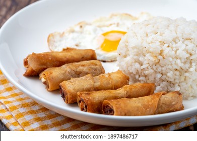 Shanghaisilog  (side Shot Without Cutlery)- Is A Famous Filipino Meal That Consists Of Fried Rice, Egg And Spring Rolls.