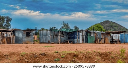 shanty town , shack made of corrugated sheet galvanized metal, township informal settlement,