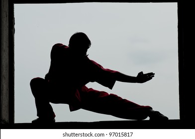 Shaolin warriors wushoo man silhouette practice martial art outdoor. Kung fu - Powered by Shutterstock