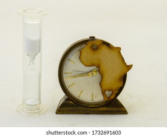 The shape of Africa on an old clock and a hourglass isolated on a clear background image with copy space in horizontal format - Powered by Shutterstock