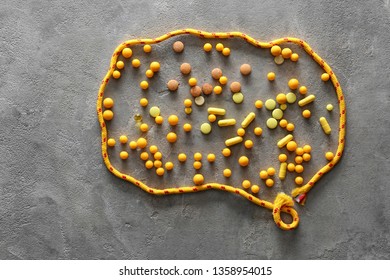 Shape Of Brain Made Of Different Pills And Elastic On Grunge Background