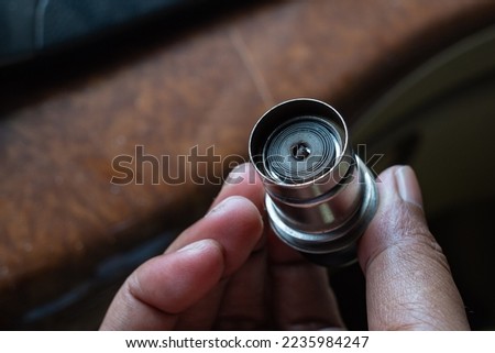 shape of the cigarette lighter in the car