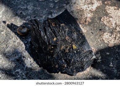 The shape and texture of the eighth person made of burnt wood