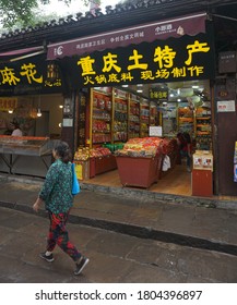 Shapingba District, Chongqing, China, 09.18.2018, Woman Walking Along Snack Shops On Empty Chenmahua Street 