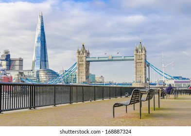 The Shard And Tower Bridge With An Empty Bench In London, UK