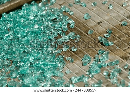 Shards of broken glass from a smashed windshield