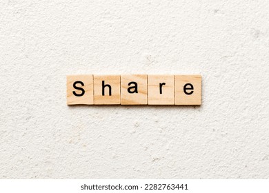 share word written on wood block. share text on table, concept.