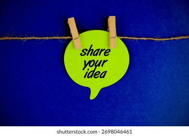 Share Your idea text message on sticky note on blue background