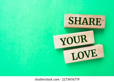 Share Your Love Words On Wooden Blocks On Green Background.